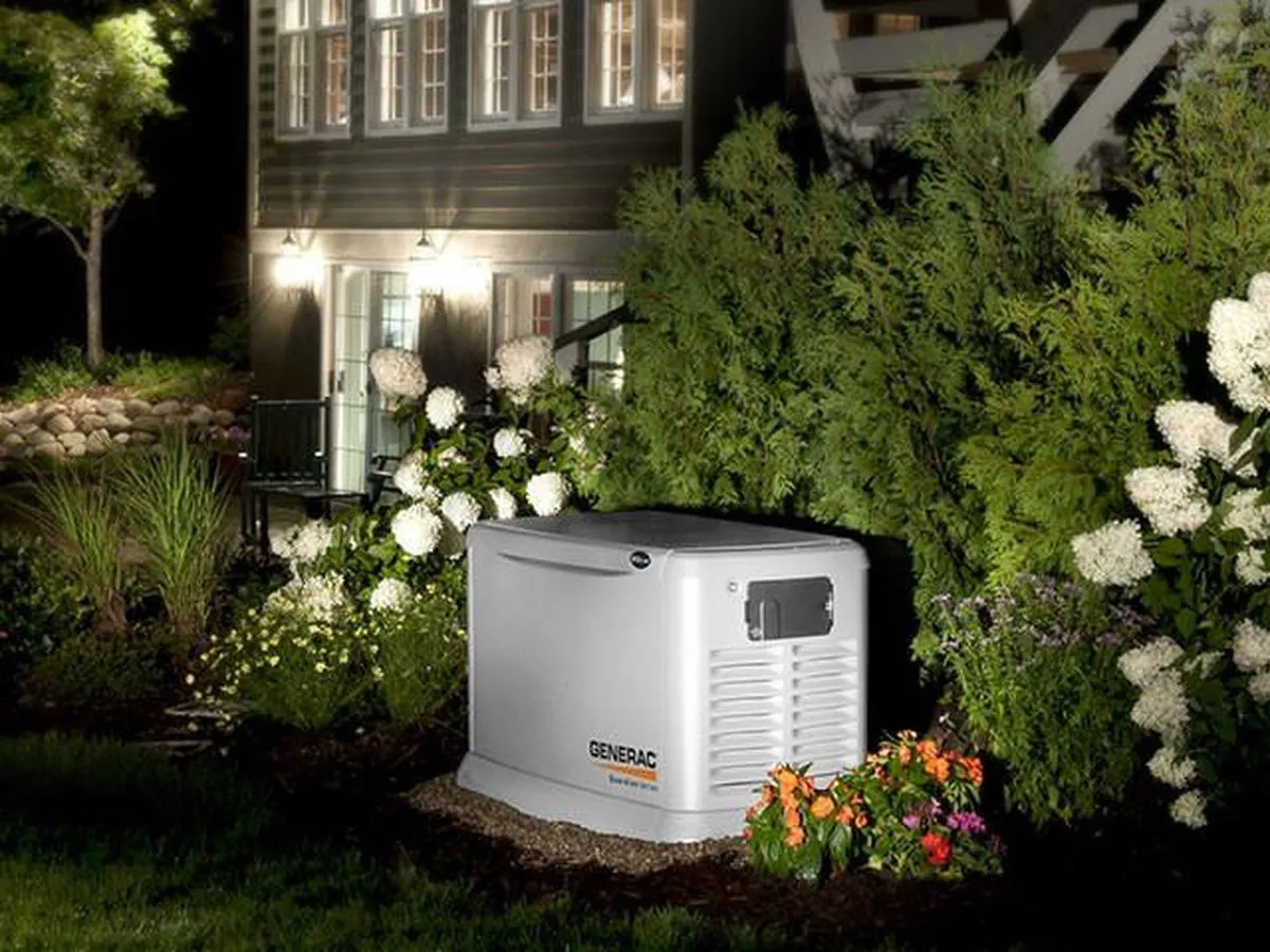 Generac standby generator beside a house